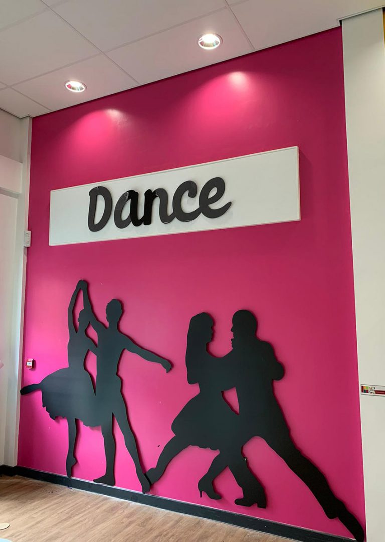 Silhouette wall signs of people dancing for a Primary School