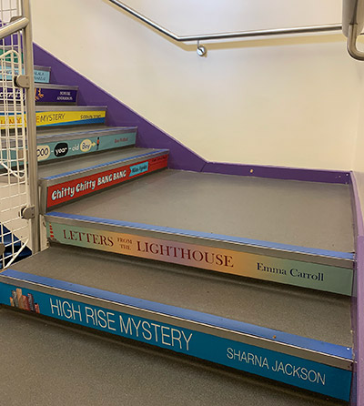Book spine stair graphics for a Primary School
