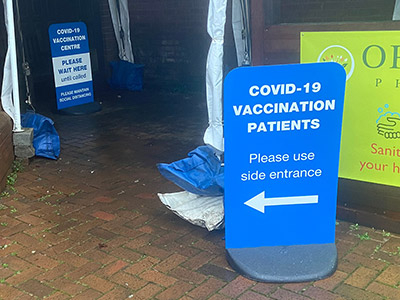 Covid-19 Vaccination Centre pavement stand signage