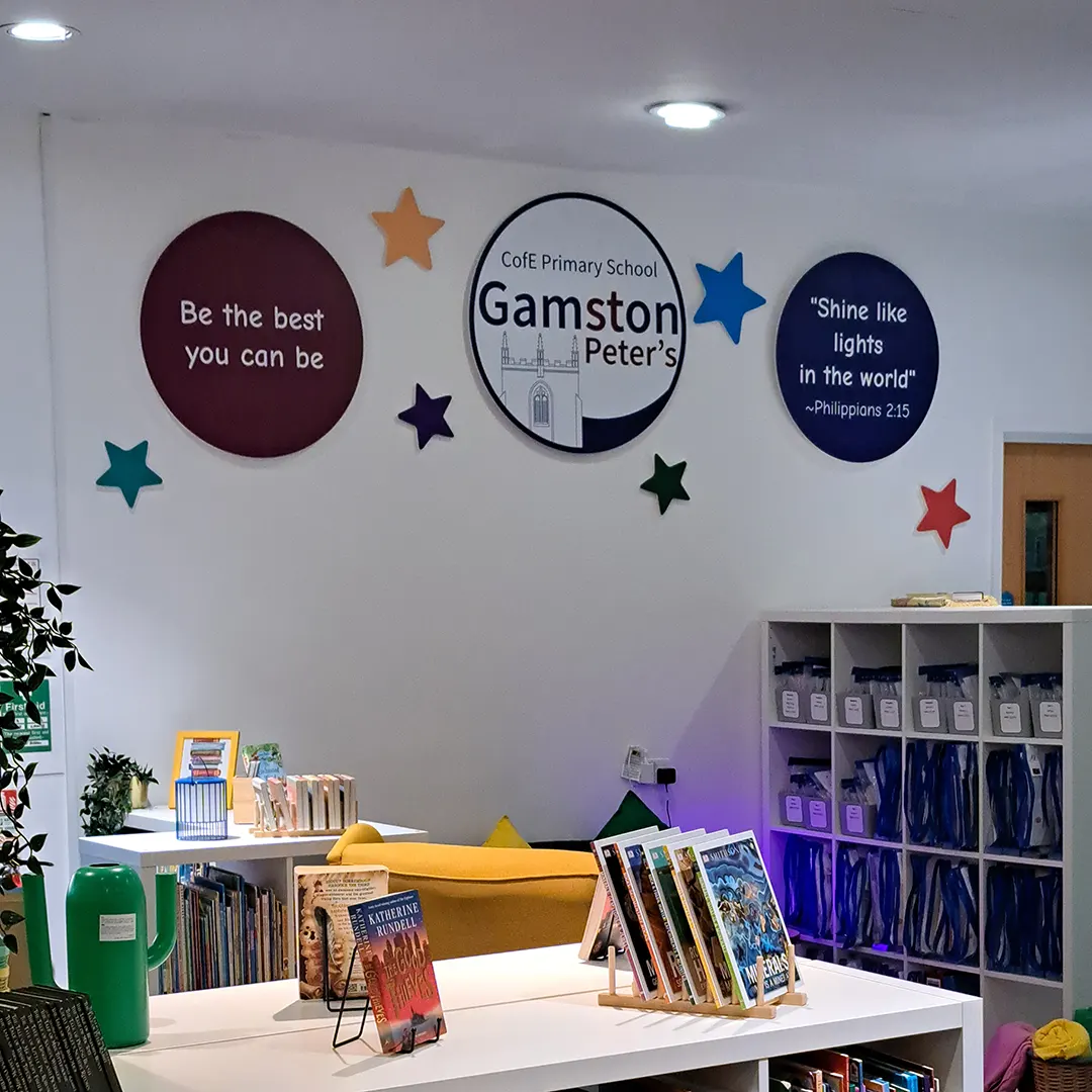 School values signage featuring the logo, values and a quote