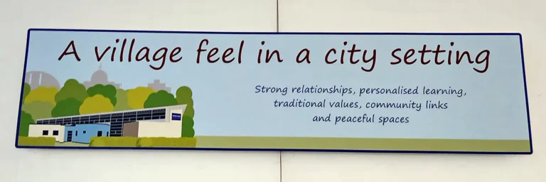internal-signage-howe-park-school-milton-keynes-4 Internal sign on school hall wall featuring an illustration of the school in front of trees and the Milton Keynes skyline - Howe Park School, Milton Keynes