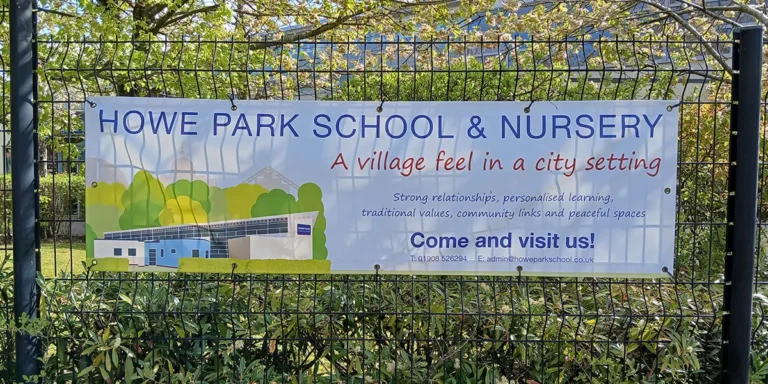 pvc-banner-howe-park-school-milton-keynes-2 PVC banner fitted to a fence at the front of the school encouraging parents to visit the school - Howe Park School, Milton Keynes