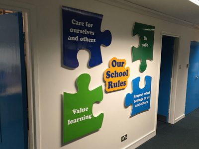 School rules wall signage in jigsaw shapes